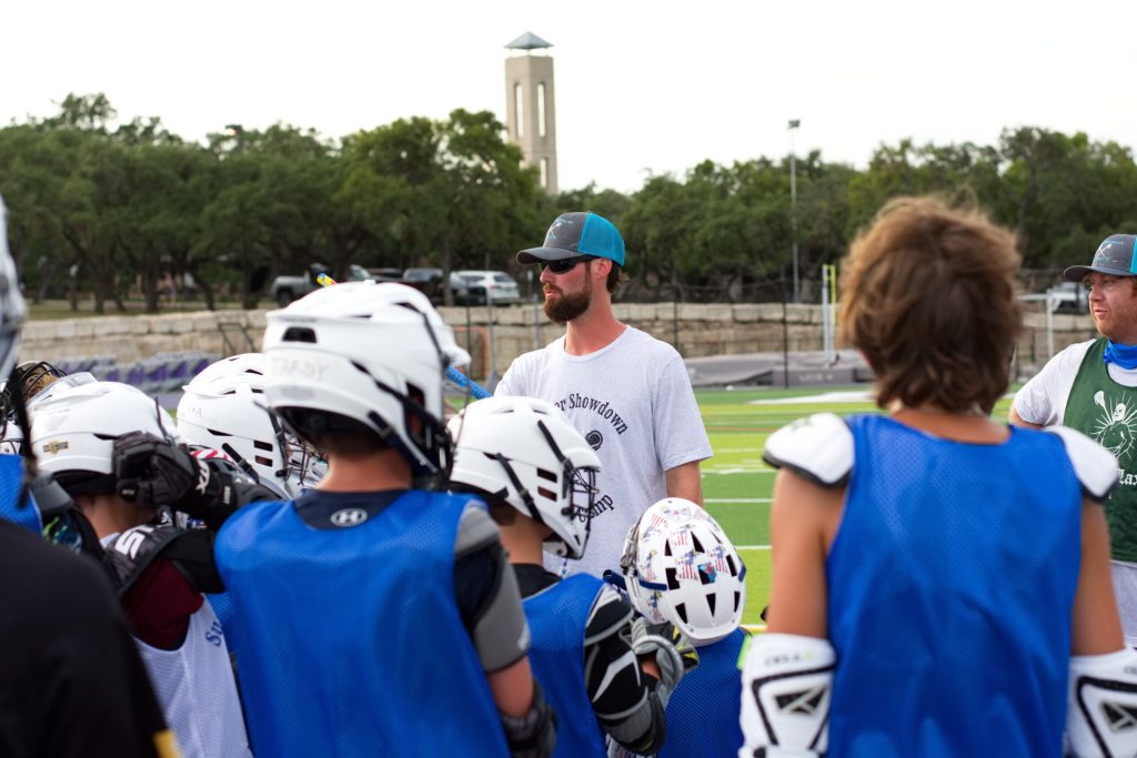 Coach Paul with his college lacrosse team on campus