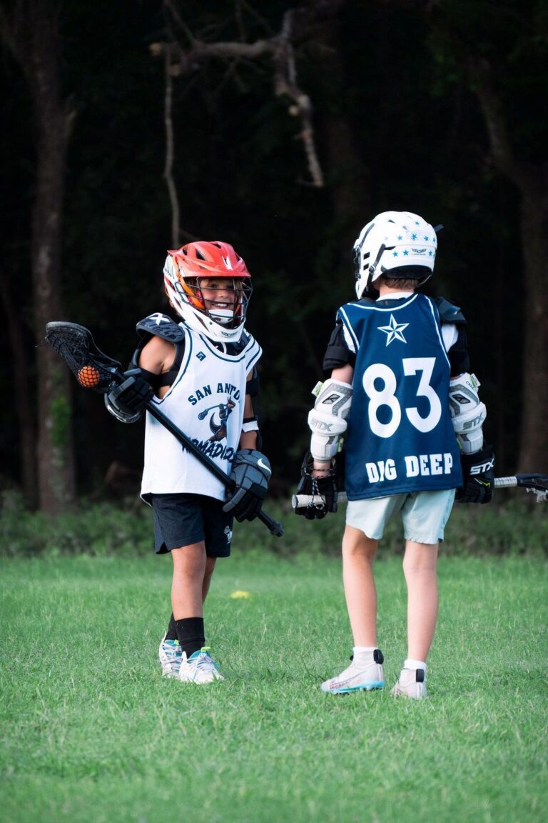 SA Armadillos player carrying the ball upfield in a youth lacrosse tournament
