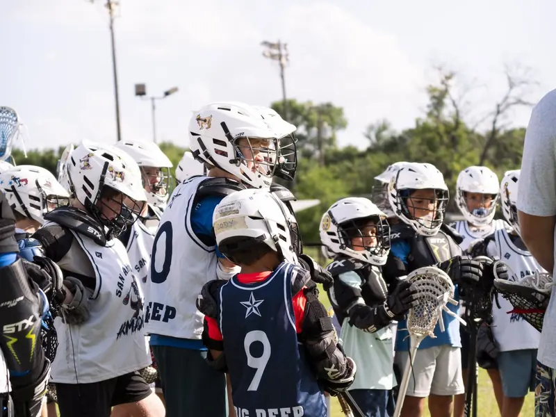 SA Armadillos players on the sideline at a San Antonio lacrosse tournament