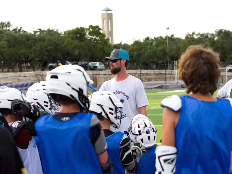 Coach Paul with young lacrosse players in San Antonio