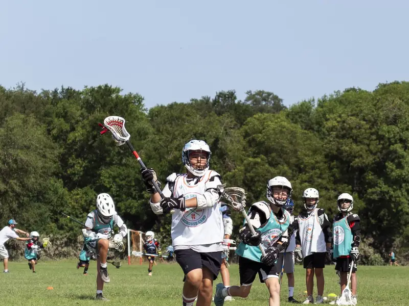 Young lacrosse player learning the game in San Antonio