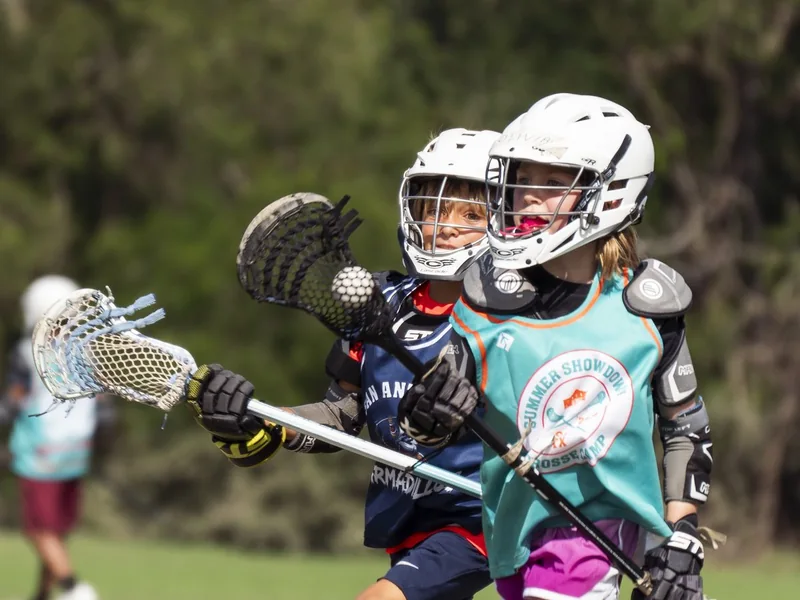 Girls youth lacrosse players competing in San Antonio