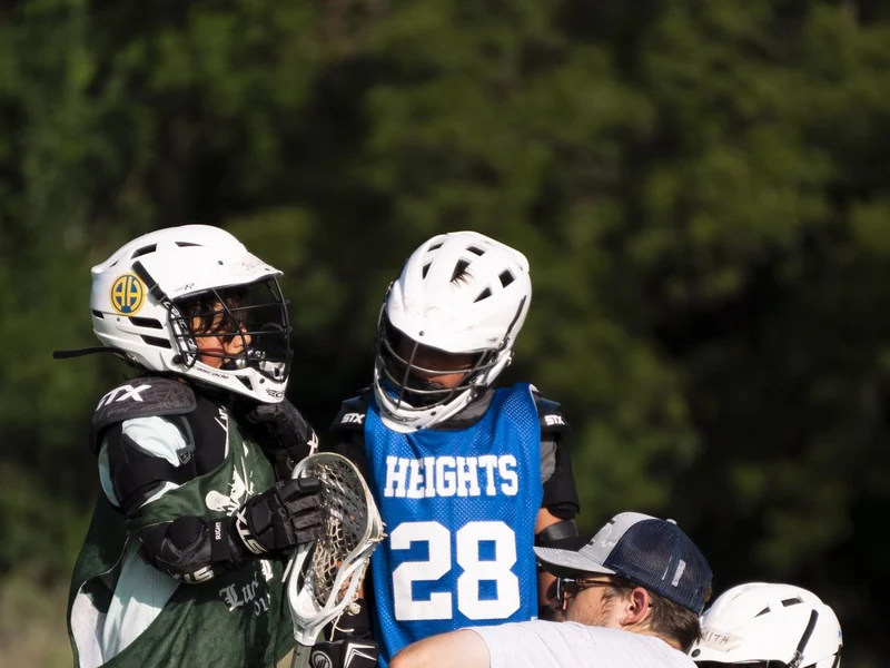 Coach Paul Taylor with lacrosse players during a training session