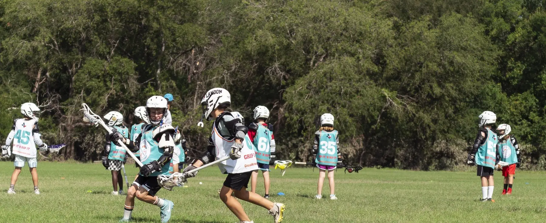 Youth lacrosse game on a full field in San Antonio