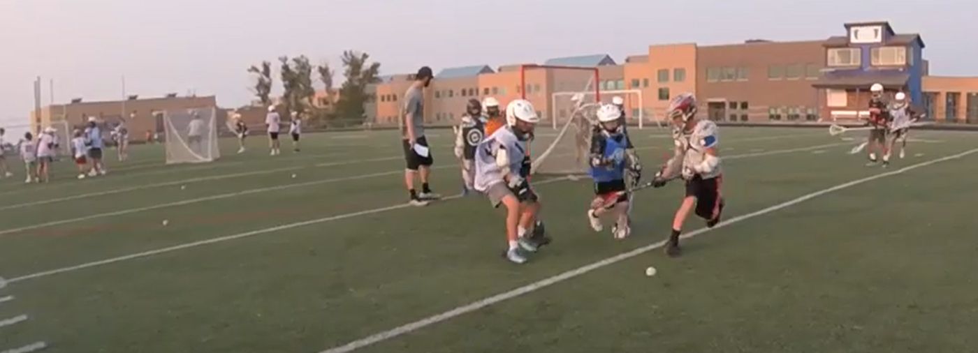 Two young lacrosse players in uniform during a Great American Lacrosse session in San Antonio